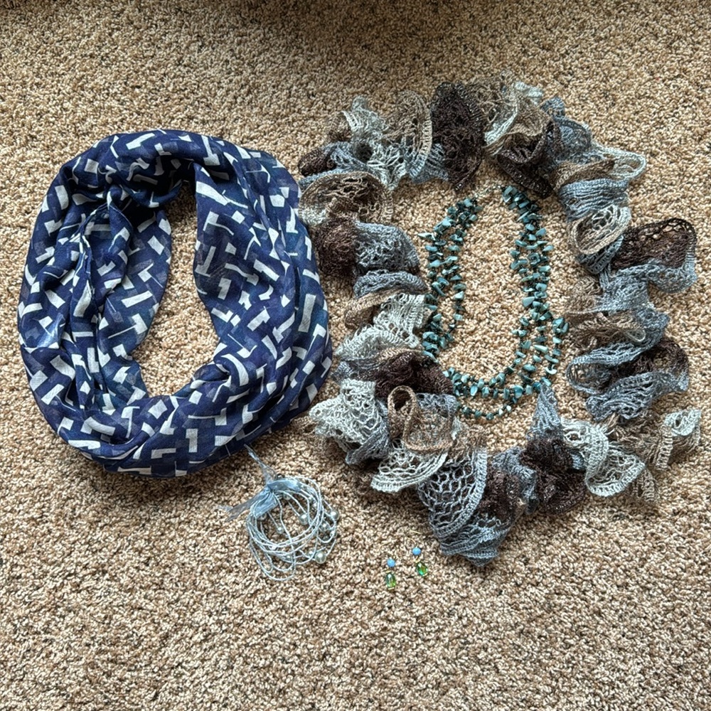 3 piece women’s jewelry and 2 scarves.